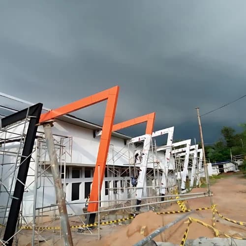 DKS archive: orange structural frame during construction